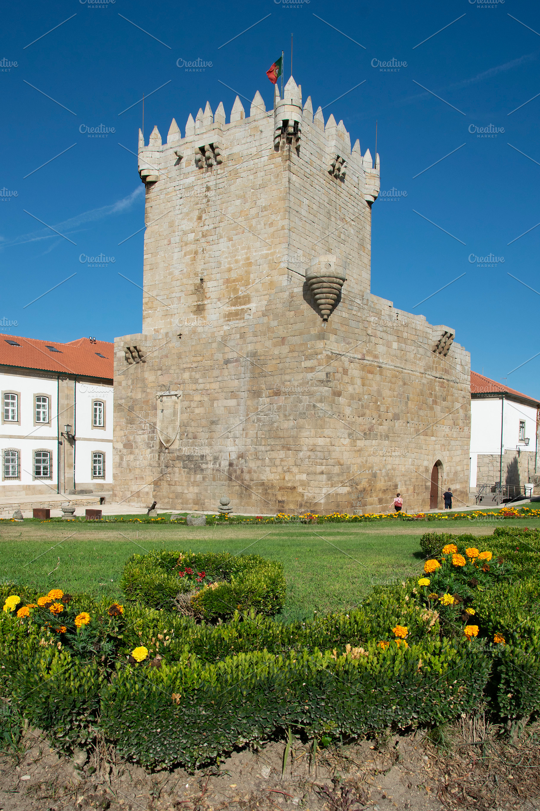 Medieval keep of chaves castle with a garden in the foreground, an Architecture Photo by DanFLCreativo