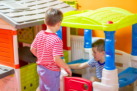 Children play in indoor playground.