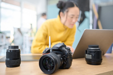Photography camera, laptop and woman editing photoshoot, focus on digital art or retouching artistic photo. Graphic tablet, creative vision and professional photographer working on creativity process, a Photo by Peopleimages.com