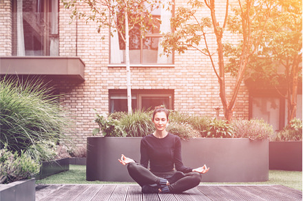 Young woman doing yoga, a School & Education Photo by MAnuta