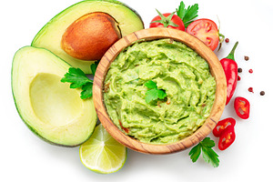 Guacamole bowl and guacamole ingredients isolated on white backg, a Food & Drink Photo by Volff