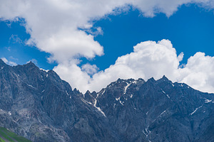Sharp rocks of Caucasus ridge under blue cloudy sky with copy sp, a Photo by Pictures for you!!!!!!!!!