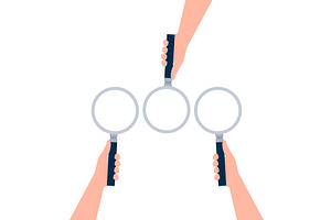 Hand holding a magnifying glass