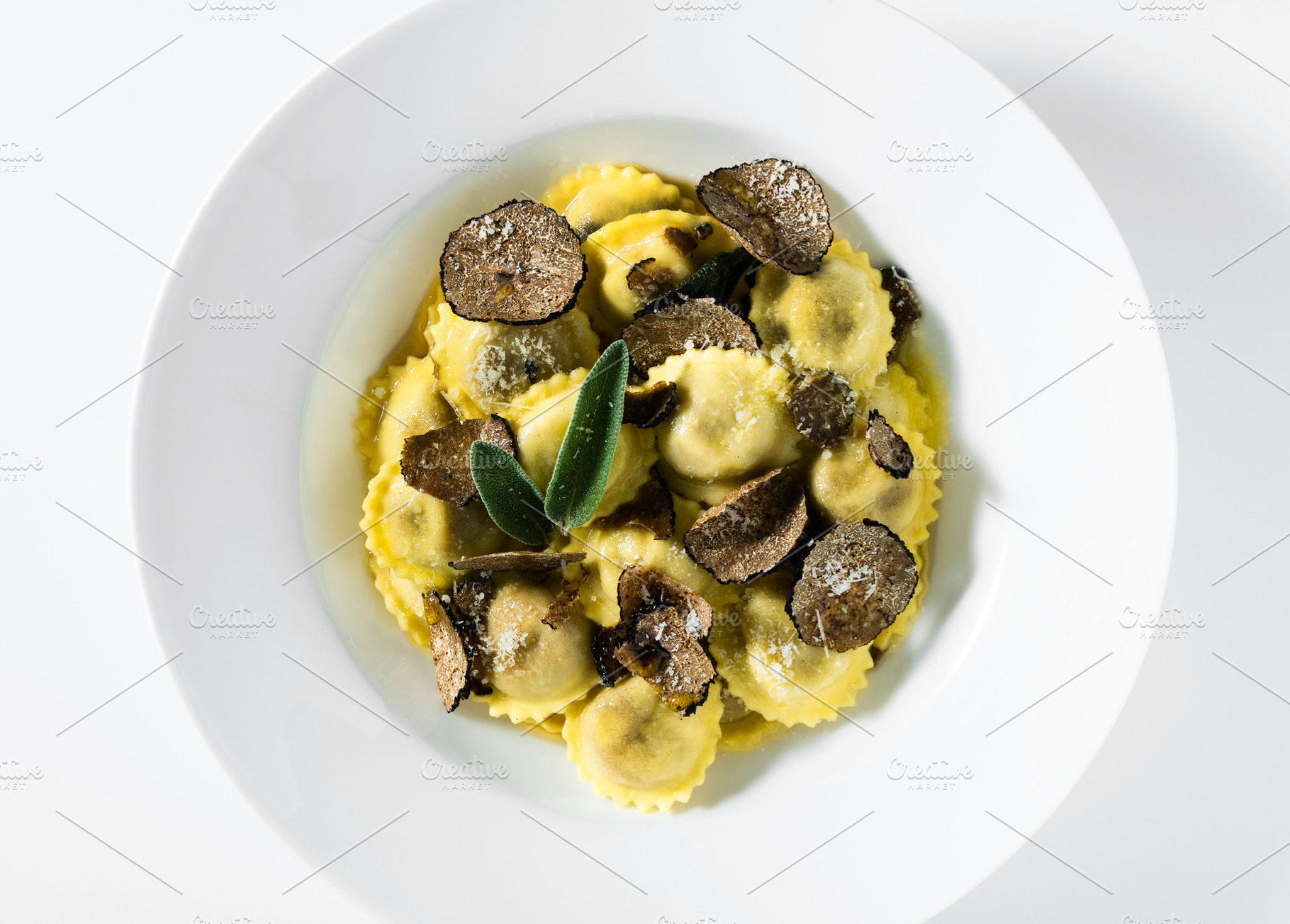 Italian ravioli with butter, parmesan cheese and truffle on the, a Food & Drink Photo by IriGri