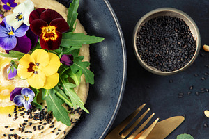 Gourmet Hummus with Edible Flowers, Black Sesame, and Pine Nuts, a Food & Drink Photo by Natalia Klenova's Shop