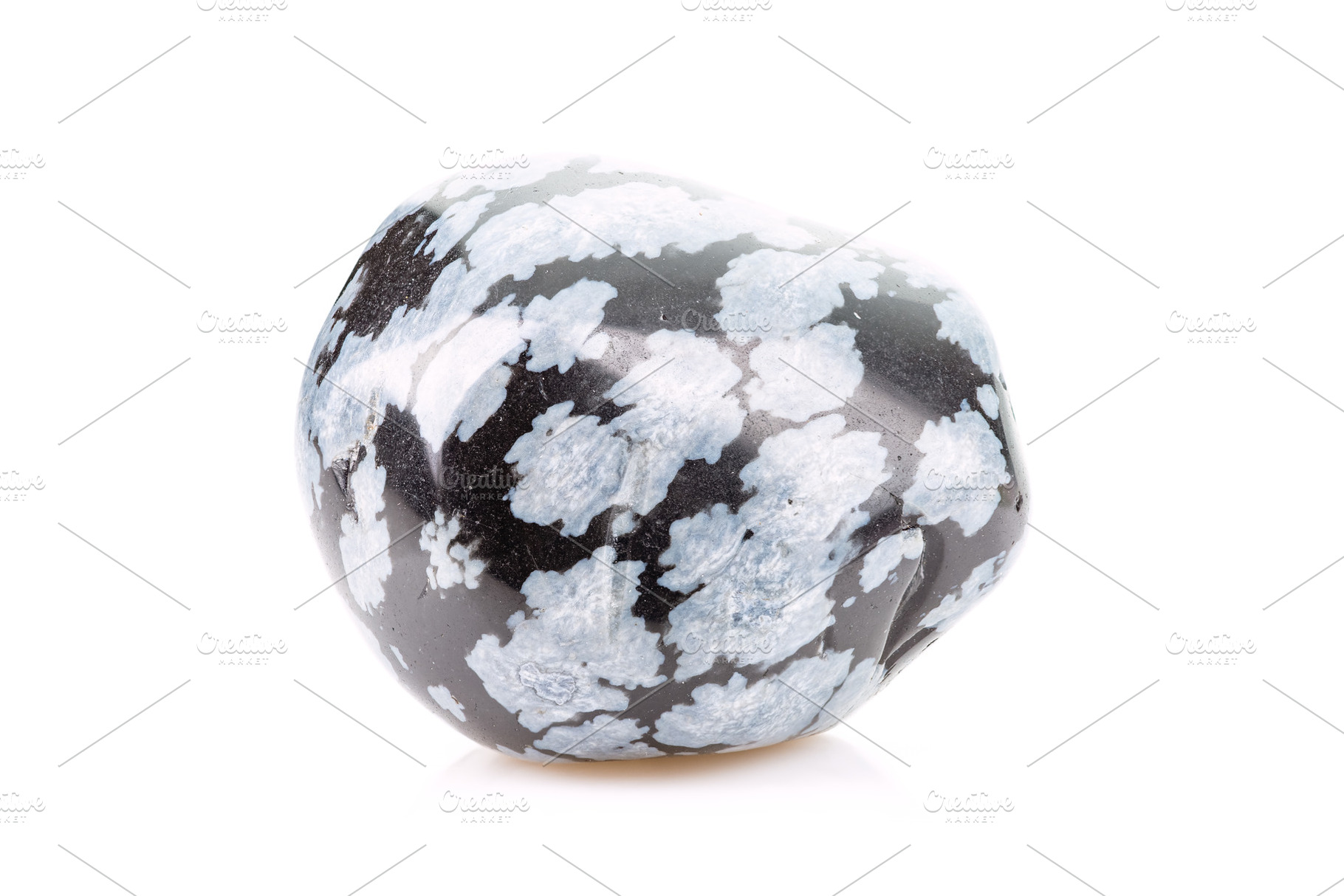 Tumbled Snowflake Obsidian Stone, an Industrial Photo by Andriana Syvanych