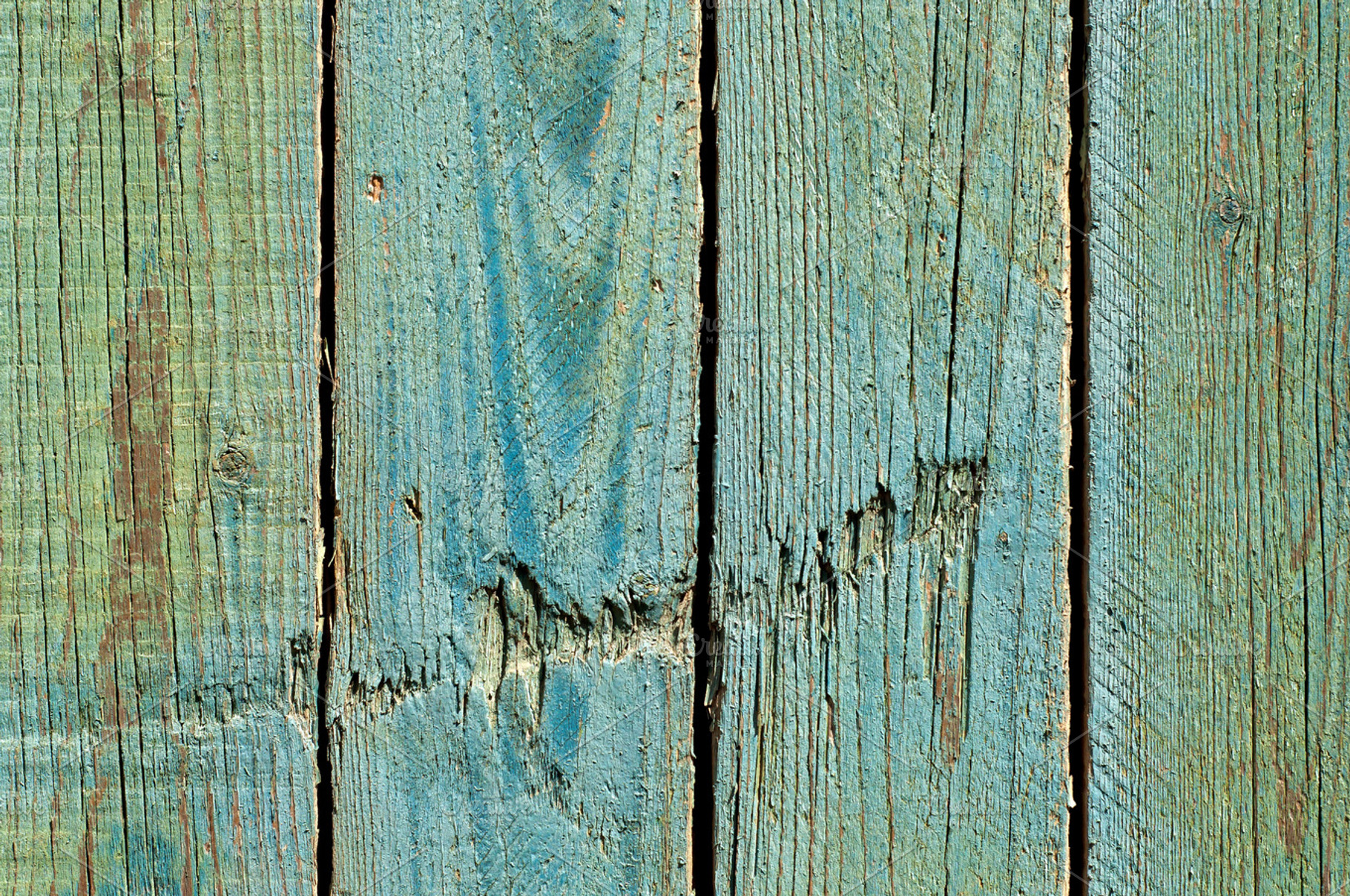 Damaged wooden planks containing wood, green, and background