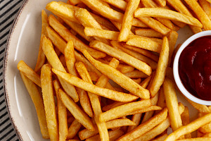 Homemade Golden French Fries with Ketchup, top view., a Food & Drink Photo by LiudmylaChuhunova