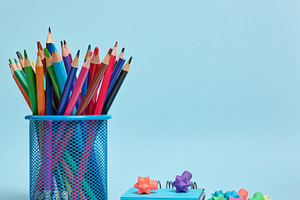 Stationery set colored pencils in a glass and an eraser symboliz, a School & Education Photo by ndanko