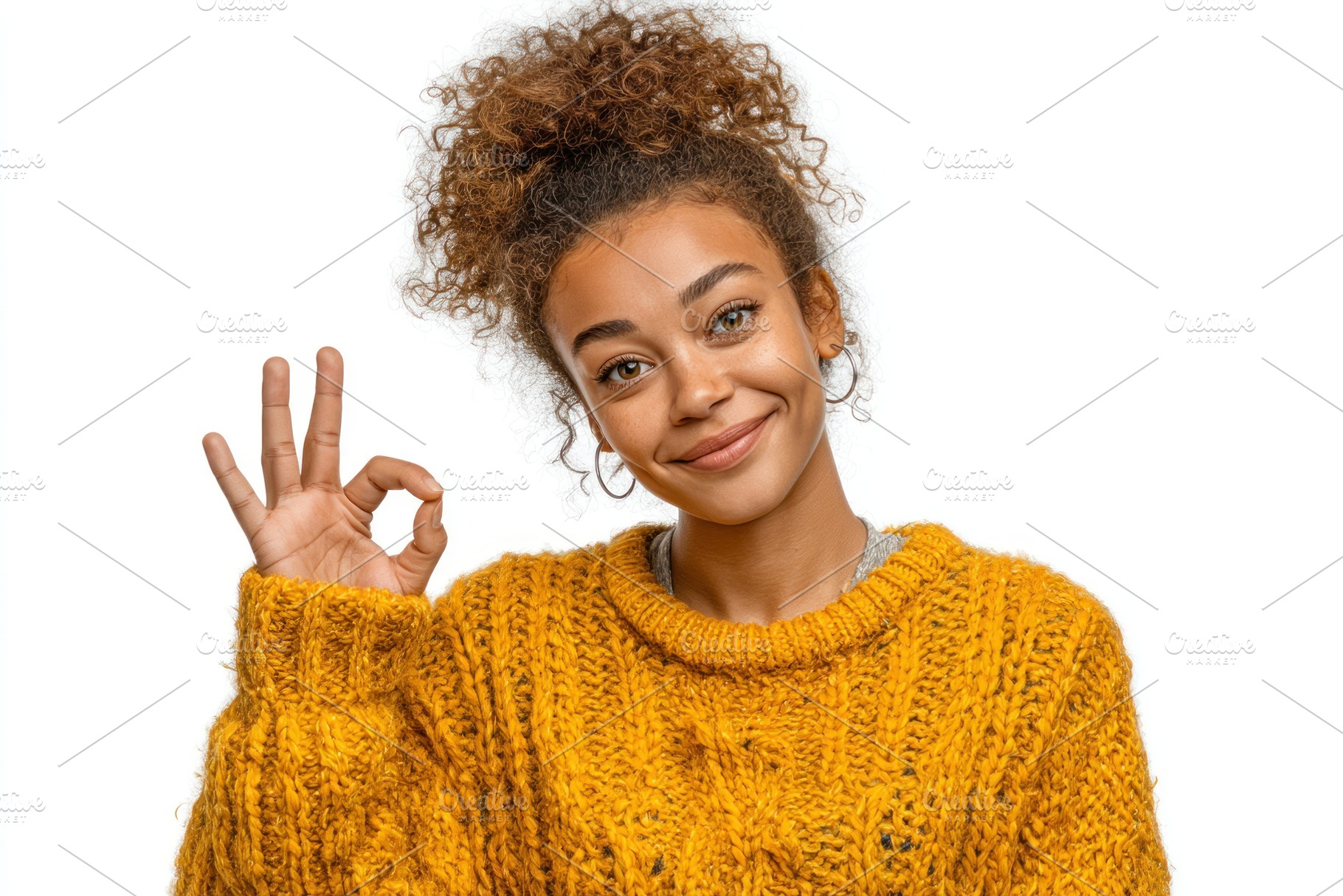 Smiling young woman with curly hair in yellow knit sweater makin, a Person Photo by José Manuel Gelpi