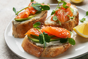 Smoked salmon bruschetta with avocado, cream cheese, and microgr, a Food & Drink Photo by Olena Rudo