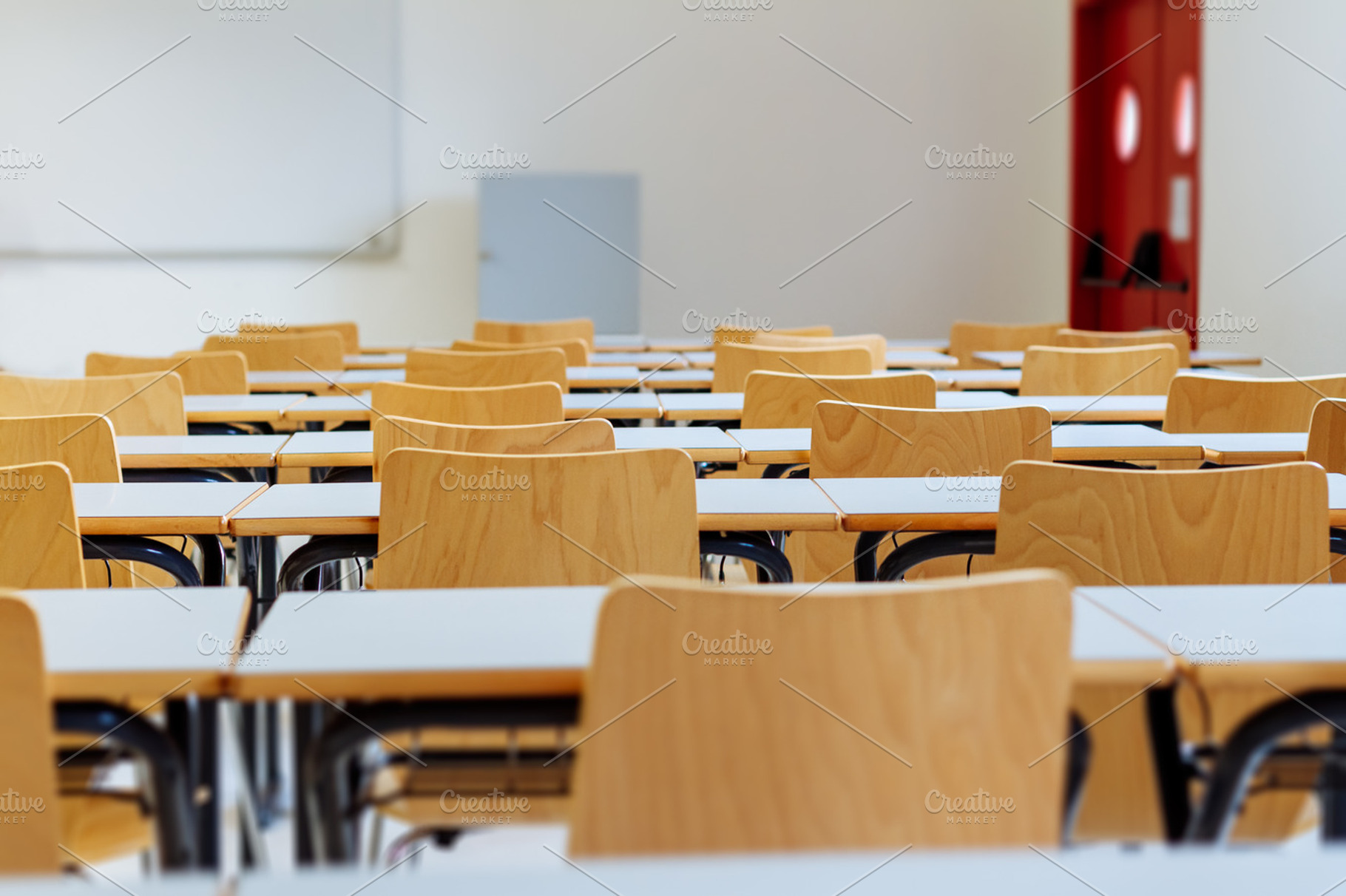 Desk and chairs in classroom stock photo containing classroom and school, a School & Education Photo by OSORIOartist