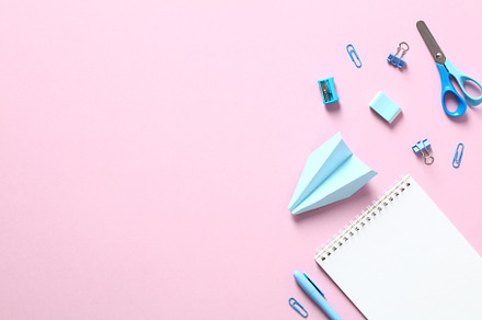 Back to school creative layout. Flat lay blue school supplies on pink table., a School & Education Photo by photoguns