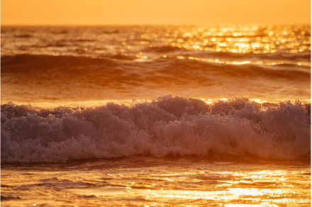 Breaking ocean wave on sunset, a Nature Photo by f9photos