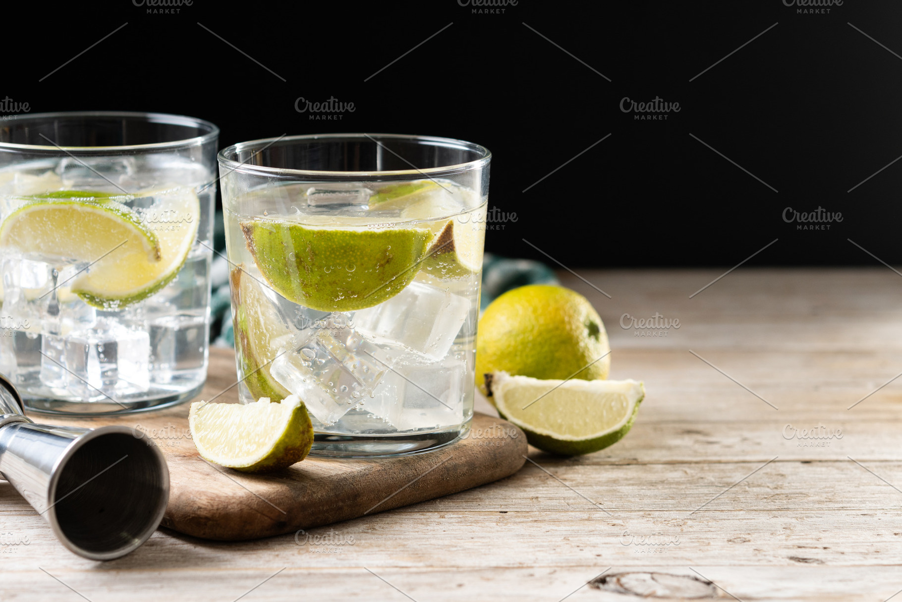 Glass of vodka tonic cocktail on wooden table, a Food & Drink Photo by etorres69