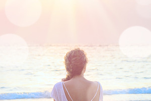 Woman practicing yoga at sunrise beach featuring woman, summer, and beach