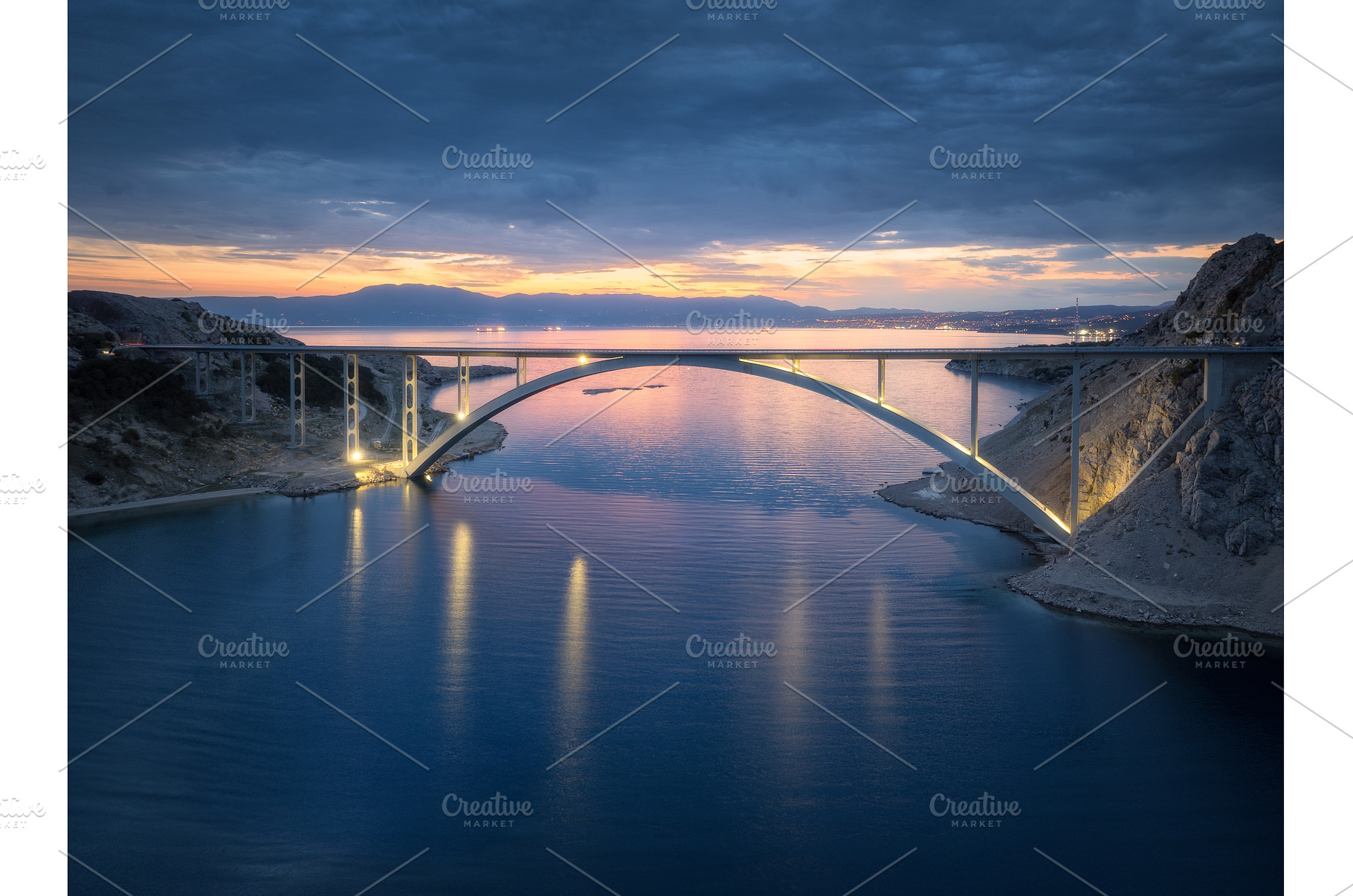 Bridge over the sea at sunset, an Architecture Photo by den-belitsky