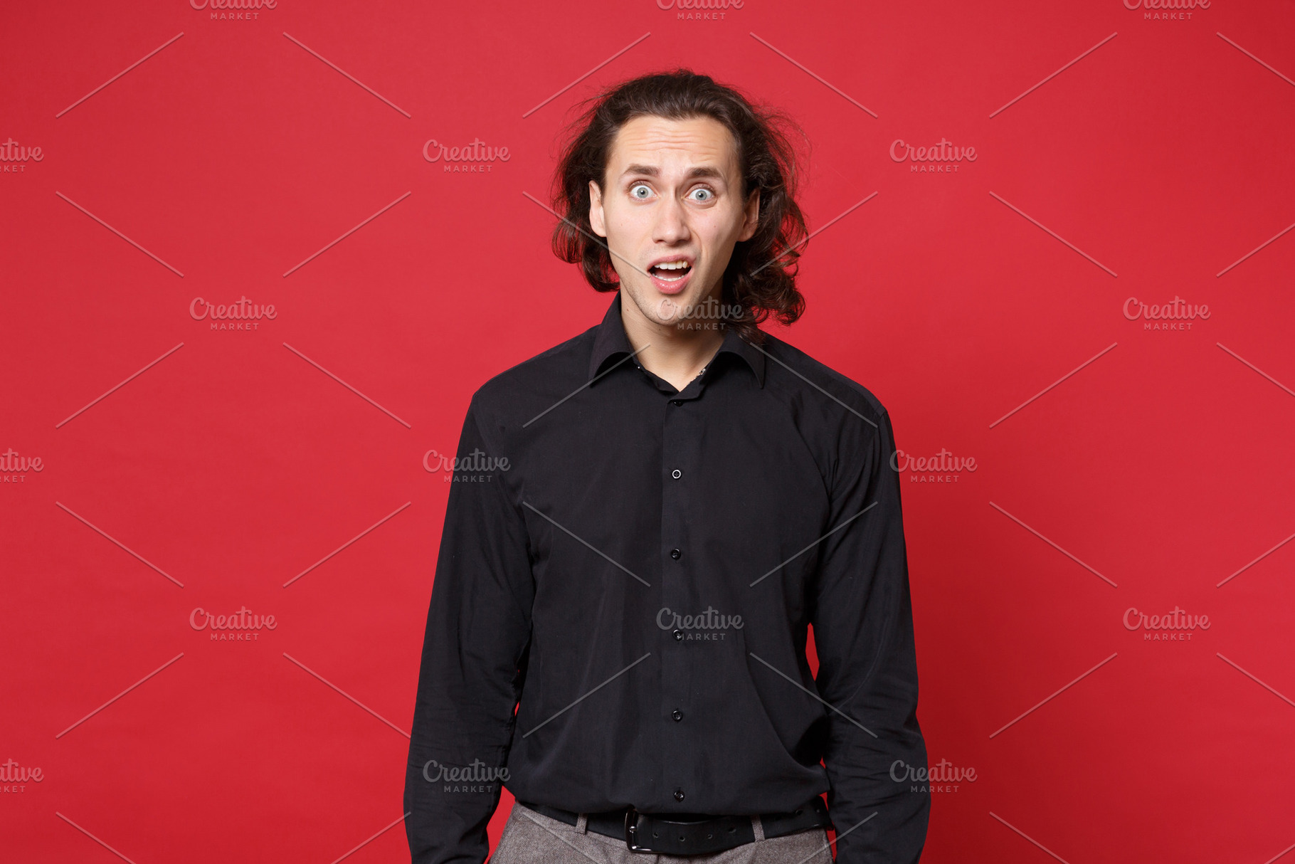 Young sad curly long haired man in b containing guy, man, and male, a Person Photo by ViDi Studio