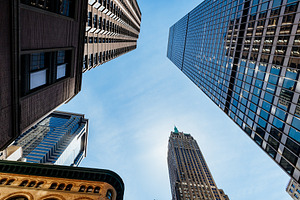 Looking up at tall buildings featuring architecture, building, and business
