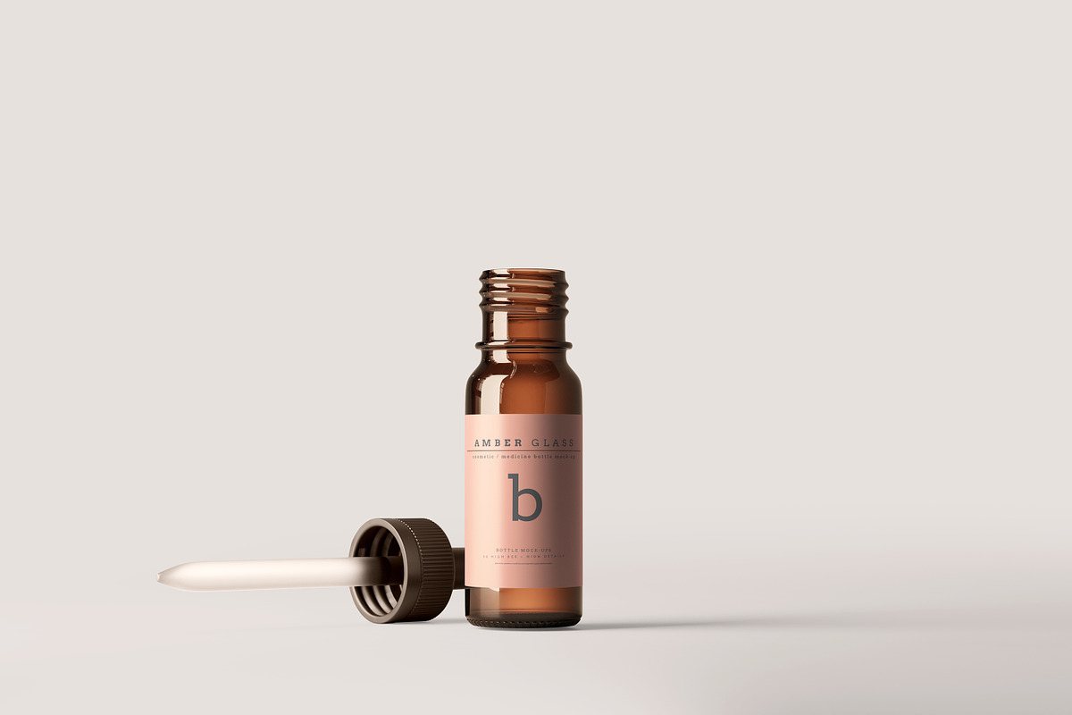 Amber Glass Dropper Bottle Mockups, a Cups & Container Mockup by pmvch (Photo 12 of 20)