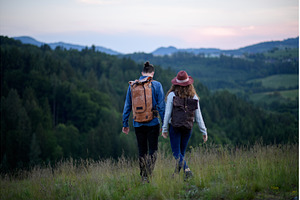 Travellers couple hiking on trail in, a Person Photo by HalfPoint