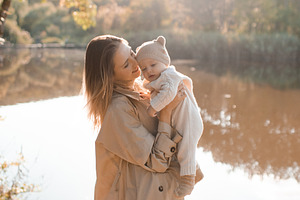Mother with baby boy over nature