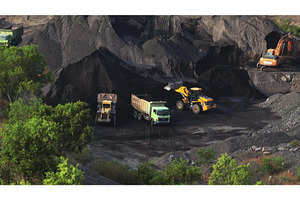 Heavy machinery excavating coal in, an Industrial Photo by Goinyk