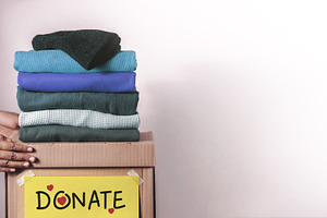 Clothes Donation, Renewable Concept,Hands folding and packing cl, a Photo by salmon.black