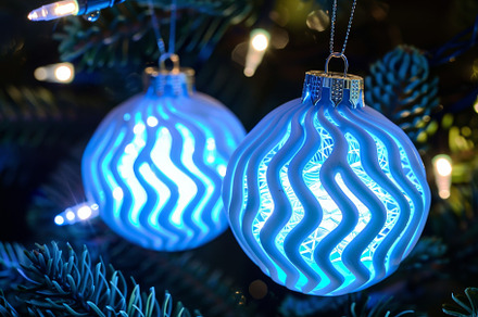Two glowing LED blue ornaments are h, a Photo by Iftikhar Alam