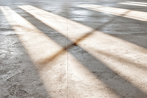 Clean empty floor with shadows highlighting the surface in a spacious environme, a Photo by AlyaAnd