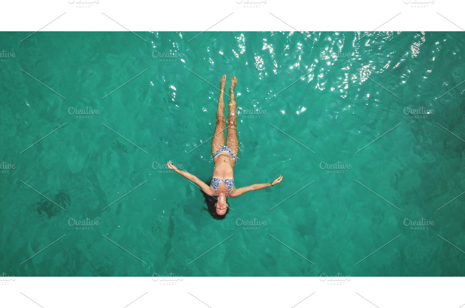 Woman floating on back in turquoise, a Person Photo by Goinyk