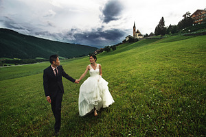 Happy newlyweds in italy containing italy, alpine scenery, and church