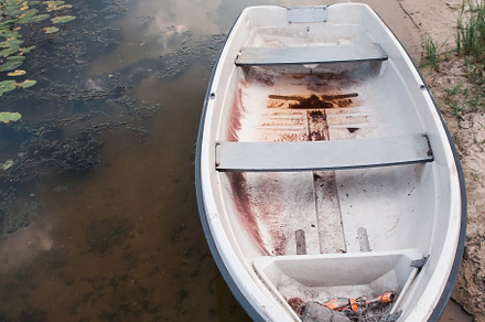 Old boat on an old wooden blue wharf on a river-lake. Top view,, a Transportation Photo by TanaCh