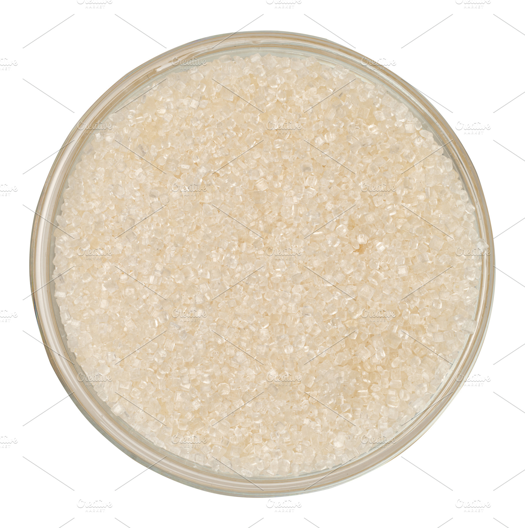 White cane sugar in a clear glass bowl, top view, isolate, a Food & Drink Photo by ndanko