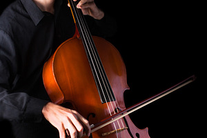 Man playing for cello, a Background Photo by OleksandrRybitskyi