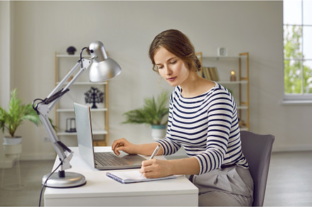 Young woman studying online, using, a School & Education Photo by StudioRomantic