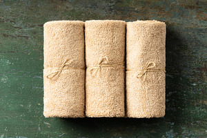 Rolled Natural Towels on Rustic Surface for Spa or Wellness Conc, a Food & Drink Photo by Natalia Klenova's Shop