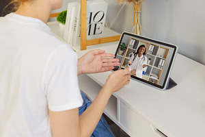 Woman Waving to Doctor on Tablet, a Person Photo by StudioRomantic