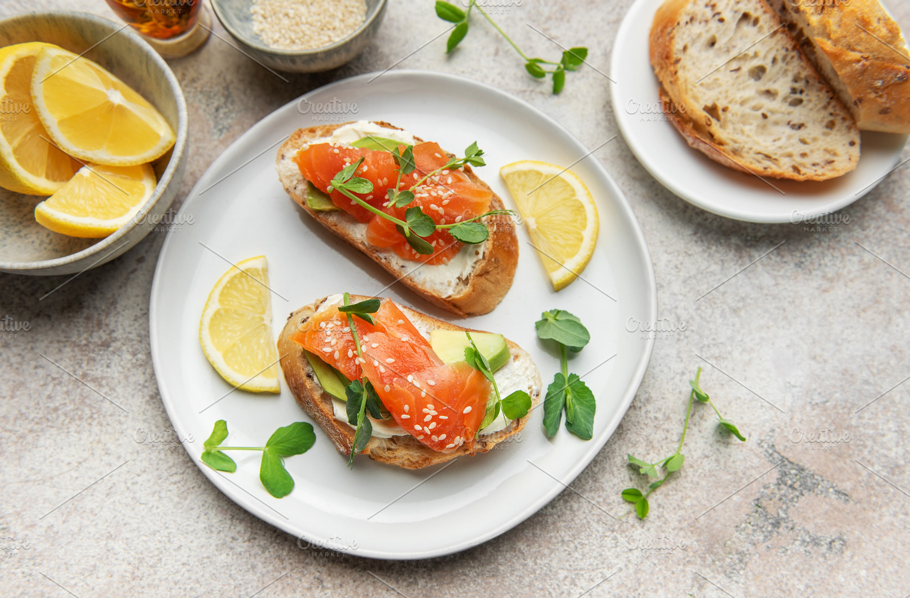 Salmon bruschetta with cream cheese and avocado slices, a Food & Drink Photo by Olena Rudo