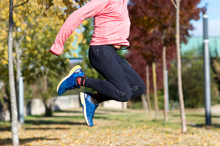 Senior man jumping high outdoors, showing energy and joy