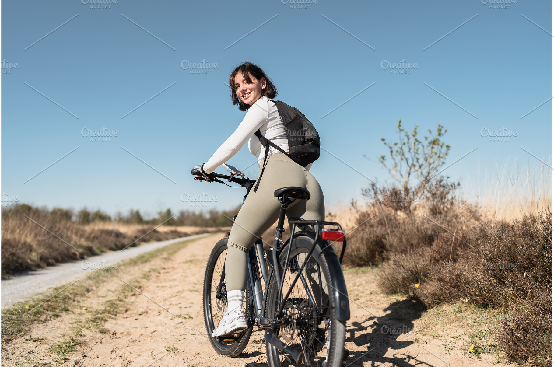 Carefree trails as a smiling woman, a Sports & Recreation Photo by AD Stock Images