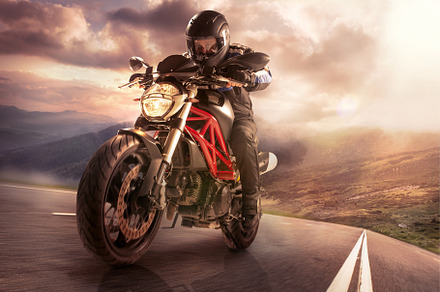 Biker on mountain highway riding around a curve with a motion blur toned with, a Sports & Recreation Photo by Volodymyr Melnyk