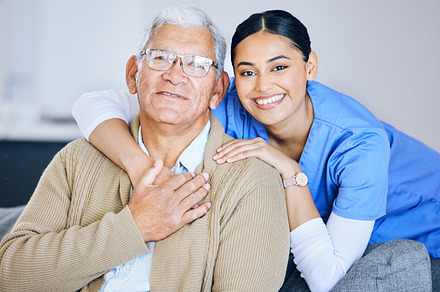 Old man, woman caregiver and portrait with retirement, health and wellness in nursing home. Happy people, female nurse and elderly male patient with hug, smile and healthcare with help and support, a Photo by Peopleimages.com