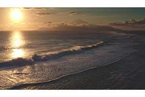 Golden sunset illuminating breaking, a Nature Photo by Goinyk
