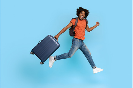 Happy tourist young black guy with, a Person Photo by Prostock-Studio