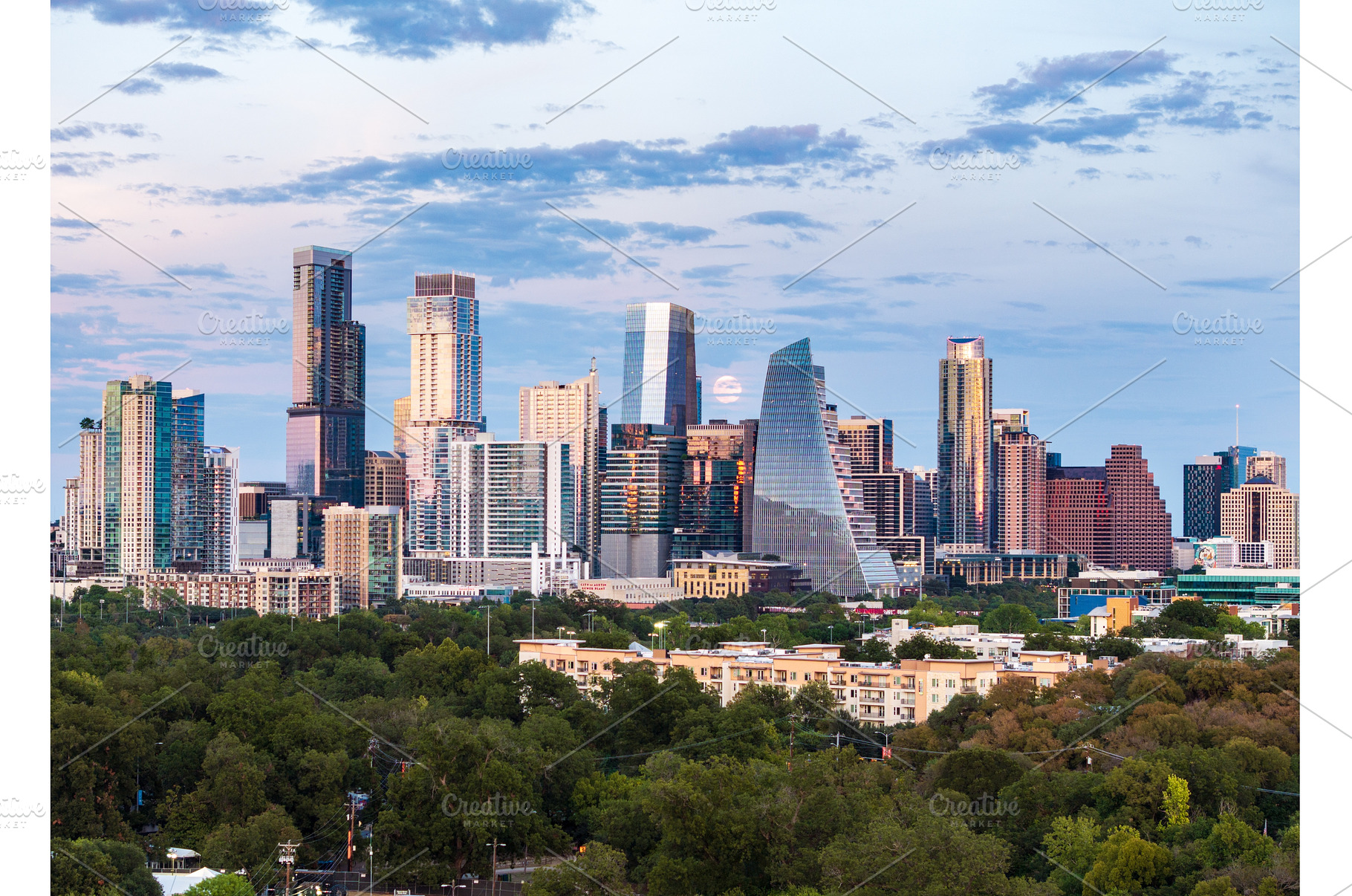 Harvest moon in the Austin skyline, an Architecture Photo by Backyard Stock