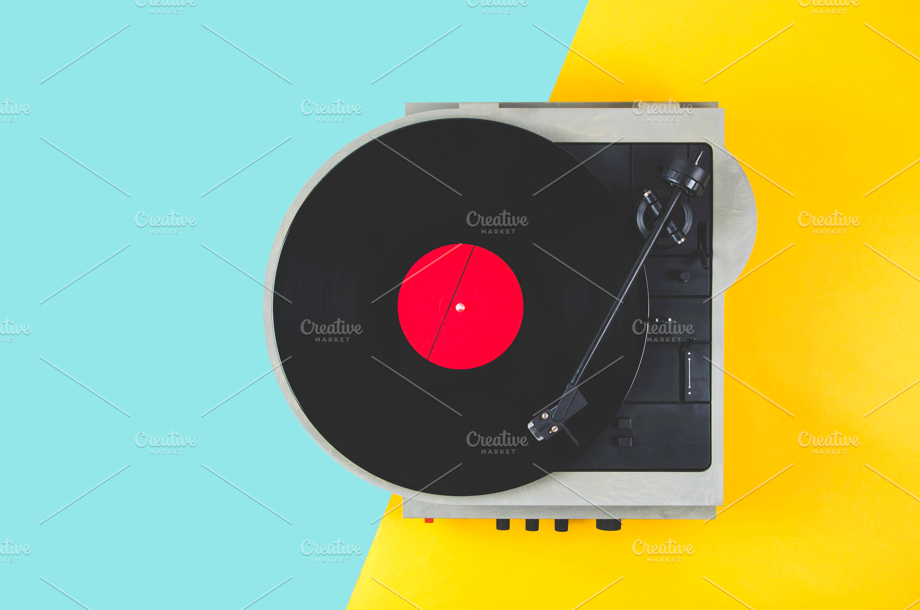 Vinyl record with red label and old featuring album, art, and background, an Arts & Entertainment Photo by Alekseyliss
