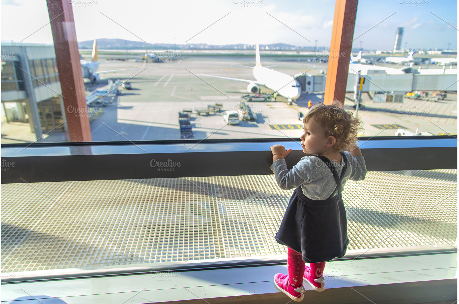 Children look at the airport at the, a Transportation Photo by yanadjana