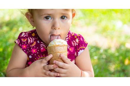 The child eats ice cream on the, a Person Photo by yanadjana