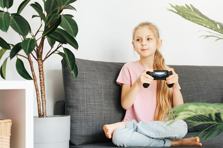 Girl playing video game at home, a Sports & Recreation Photo by Olena Rudo